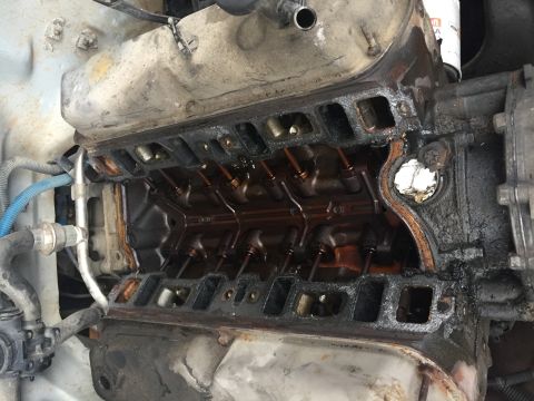 1996 Ford Bronco - Close-up view of a disassembled engine, revealing the internal workings and signs of wear.