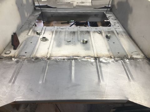 1992 Jeep Wrangler - The interior floor of a vehicle shows signs of repair and modification.