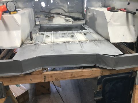 1992 Jeep Wrangler - The interior floor pan of a Jeep Wrangler is undergoing repair with new metal panels being fitted.