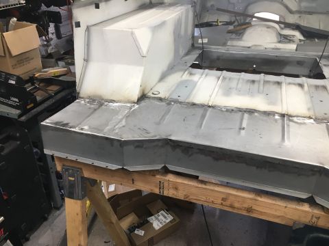 1992 Jeep Wrangler - The bare metal interior of a vehicle is shown, highlighting recent floor pan repairs and fabrication.