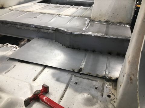1992 Jeep Wrangler - Repairing the floor pan of a vehicle, showing new metalwork and welding.