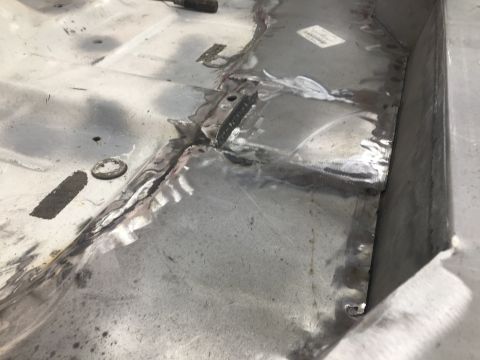 1992 Jeep Wrangler - Floor pan repair work showing welded metal patches.