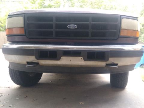 1996 Ford Bronco - Front view of a 1996 Ford Bronco, focusing on the grille and bumper details.