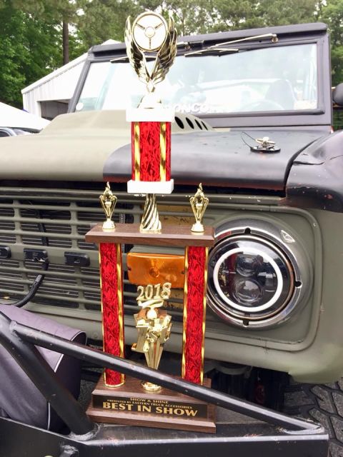 1972 Ford Bronco - A vintage Ford Bronco is displayed with multiple trophies, including one for 'Best in Show' from 2018.