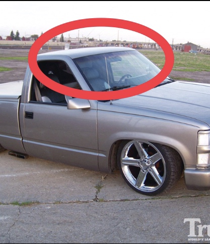1995 Ford Bronco - This pickup truck has been modified with a lowered suspension and large chrome wheels.