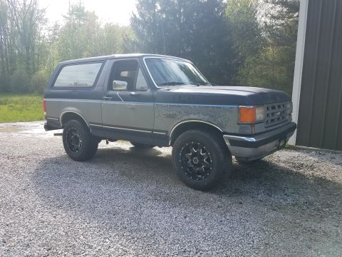 1987 Ford Bronco - This 1987 Ford Bronco is shown from the front three-quarter view, parked outdoors.