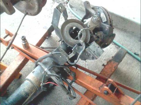 1978 Ford Bronco - Front suspension assembly with brake components, likely removed for repair or replacement.