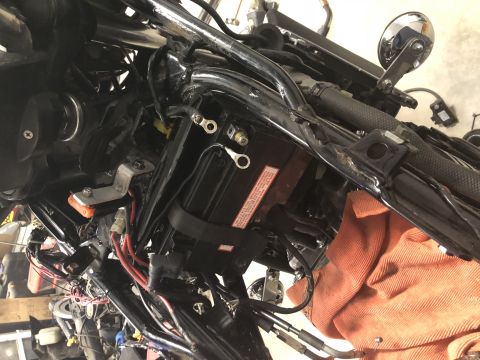 1983 Yamaha Venture - Close-up of motorcycle battery and electrical connections, with an orange cloth visible.