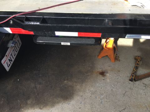 1992 Jeep Wrangler - Trailer hitch and jack stands are visible in this close-up shot.