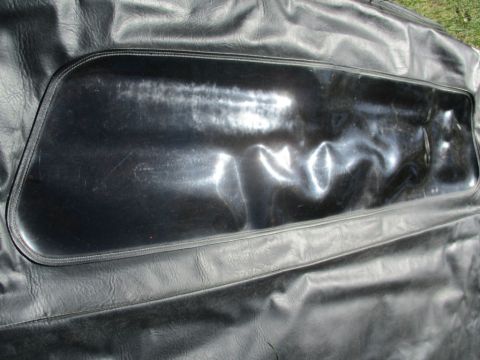 1996 Ford Bronco - The plastic window on this soft top shows signs of wear and tear, with numerous wrinkles and scratches.