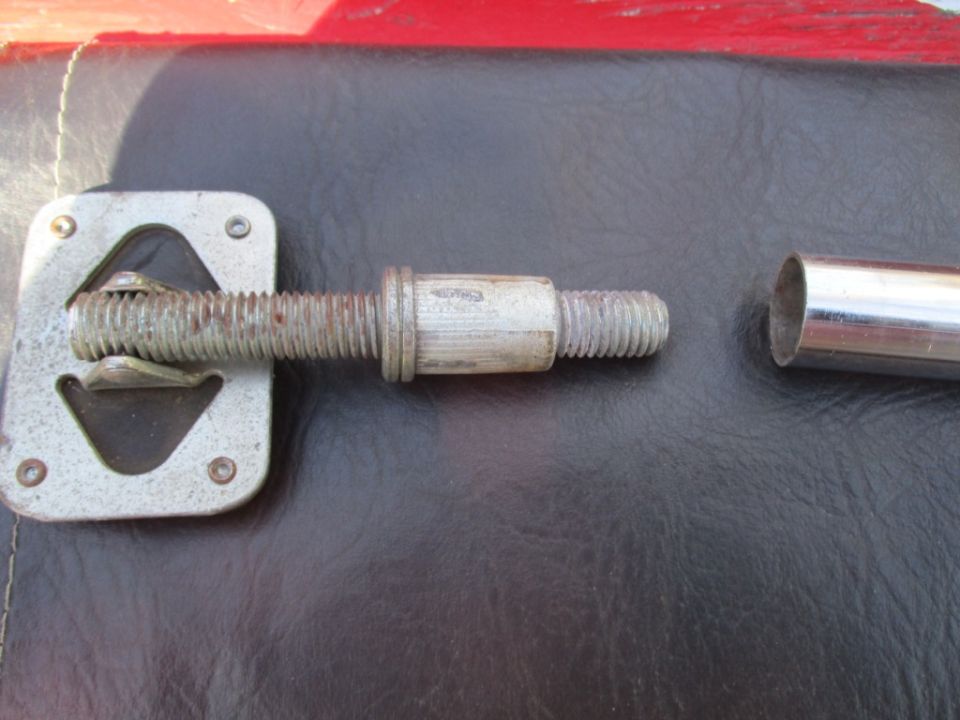 Soft top latch mechanism with threaded bolt and metal sleeve