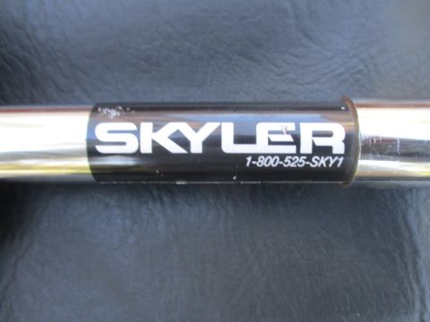 1996 Ford Bronco - A close-up shows a chrome bar with a black label the brand 'SKYLER' and a phone number.