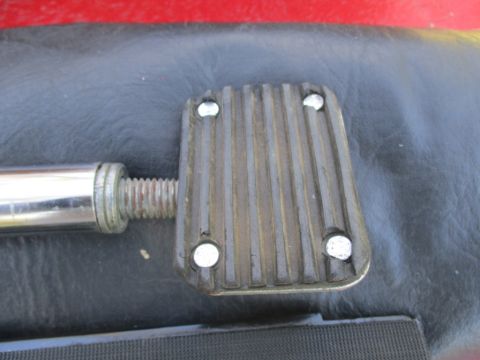 1996 Ford Bronco - Detail of a vehicle's pedal assembly, showing the textured surface and mounting hardware.