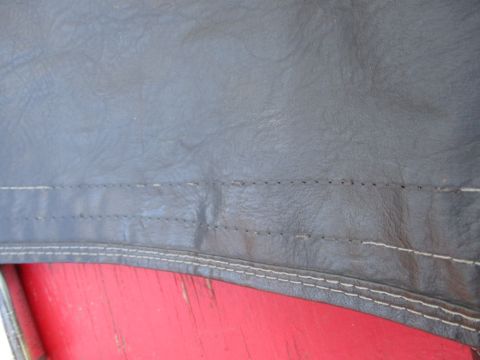 1996 Ford Bronco - Detail shot of the stitching on a vehicle's soft top, revealing the texture of the material.
