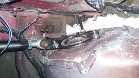 2000 Pontiac Grand Prix - A close-up view of a car's suspension system, showing mechanical components and wiring.