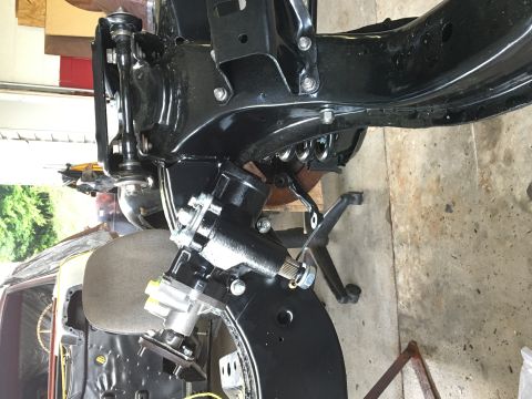 1967 Ford Galaxie - This image shows a close-up of a vehicle's chassis, focusing on the steering mechanism and suspension parts.
