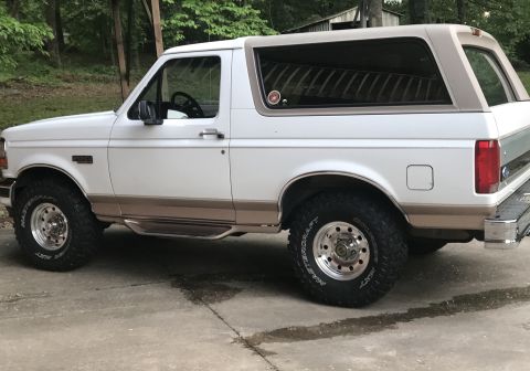 1996 Ford Bronco - This 1996 Ford Bronco is presented in a two-tone white and tan paint scheme, aftermarket wheels.