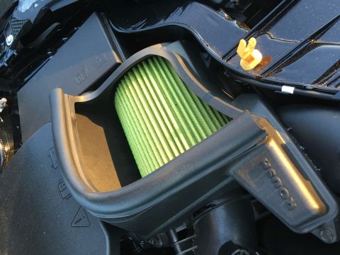 2017 Ford Focus - Close-up of a vehicle's engine air intake system, showing a green air filter and the 'ROUSH' branding.