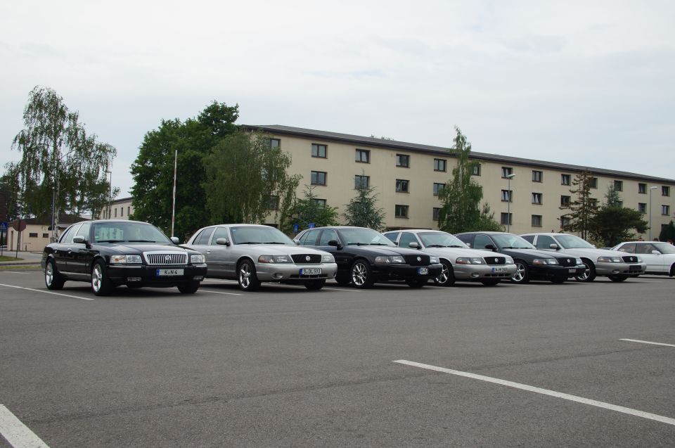 Black 2003 Mercury Marauder parked in front of a line of similar cars