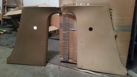 1985 Ford Bronco - Two large, brown, custom-cut panels with circular holes are shown standing upright, possibly for a vehicle interior modification. The panel…