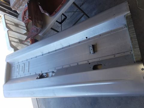 1968 Ford Bronco - The image shows the tailgate of a classic Ford pickup truck, likely from the late 1960s or early 1970s, with the "FORD" lettering embossed…
