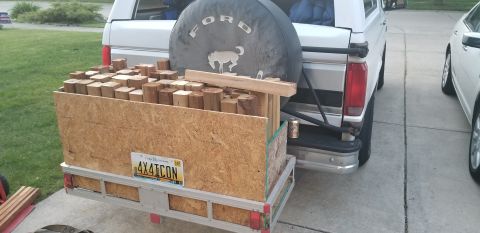 1995 Ford Bronco - A white Ford Bronco with a spare tire mounted on the back is parked in a driveway. The rear of the Bronco is loaded with a wooden crate fil…