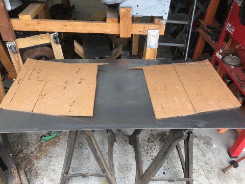 1992 Jeep Wrangler - Two cardboard templates with hand-drawn lines and text are laid out on a flat sheet of metal. The templates appear to be for custom car par…