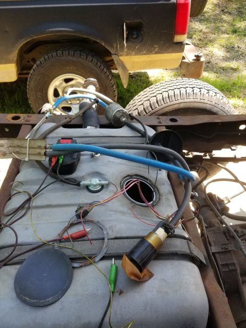 1996 Ford Bronco - Emptying the tank into mine, using an old fuel pump (probably from a Crown Vic tank), the battery pack from my cheapo cordless impact, & so…