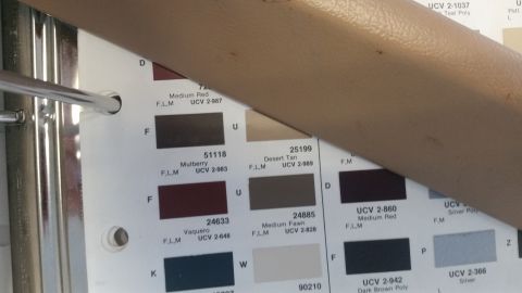 1985 Ford Bronco - Paint code reference chart showing color chips with names and codes including Medium Red, Desert Tan, Mulberry and Vaquero.