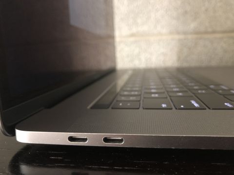 1989 Ford Bronco - A close-up, side view of a silver laptop, showing two USB-C ports on the left side and a portion of the keyboard.