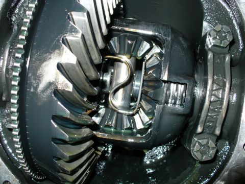 1992 Ford Bronco - Close-up view of the internal gears of a differential, likely from a 1992 Ford Bronco. The image shows the ring gear, pinion gear, and spid…