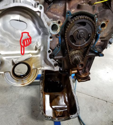 1996 Ford Bronco - The missing chunk of timing cover was resting on the splash shelf. The milk in the oil pan is just from the pressure washing. See the NEXT…