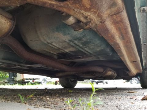 2001 Ford Crown Victoria - Photograph of the vehicle underside with exhaust and frame, not a technical document.
