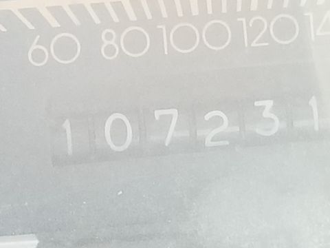 2001 Ford Crown Victoria - Photograph of an instrument cluster odometer and speedometer, not a technical document.