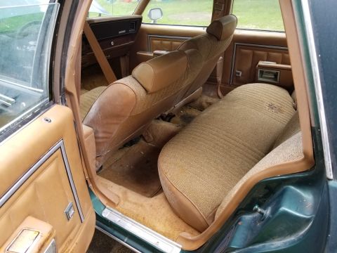 2001 Ford Crown Victoria - Photograph of a vehicle's rear bench seat and interior, not a technical document.