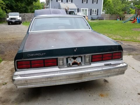 2001 Ford Crown Victoria - Photograph of a classic Chevrolet's rear end and taillights, not a technical document.