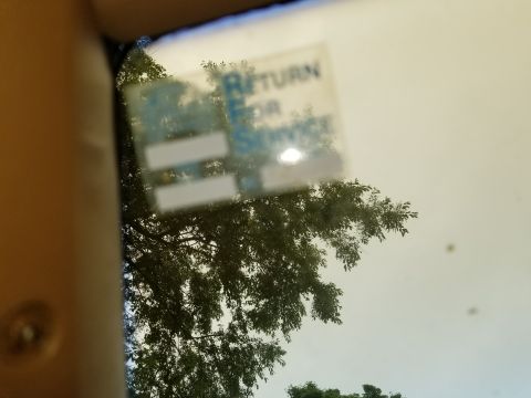 2001 Ford Crown Victoria - A sticker on the windshield indicates the vehicle is due for service.