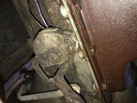 1980 Ford Bronco - Close-up view of a rusty transmission component and wiring harness, with a watermark from Supermotors.net visible.