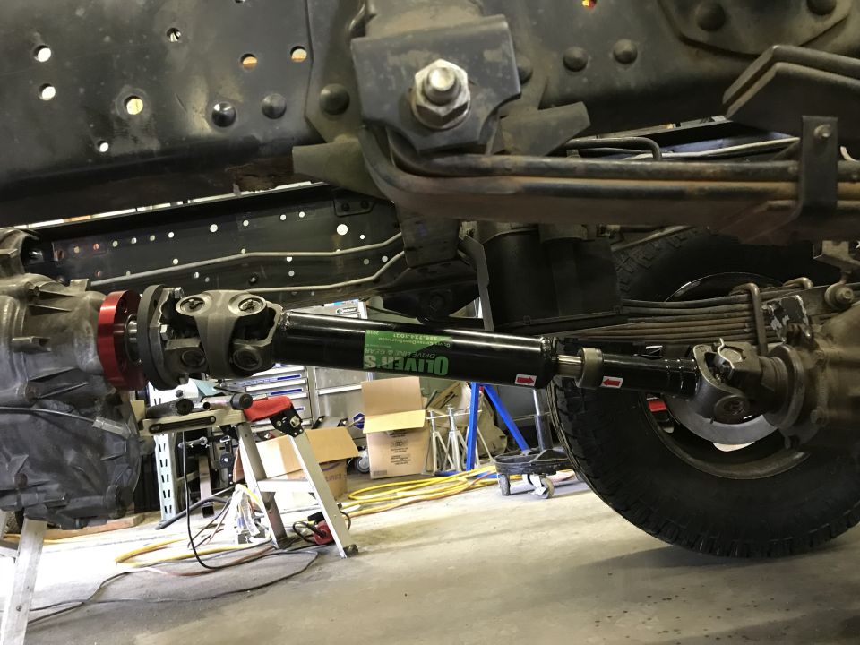 Driveshaft with Oliver's label and rear suspension components