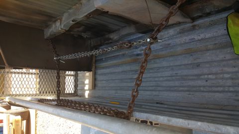 1965 Ford Mustang - Chains are securing a load in the bed of a truck.