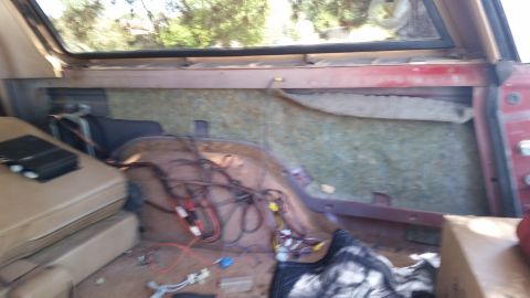 1985 Ford Bronco - Interior restoration of a 1985 Ford Bronco, with wiring and insulation exposed.
