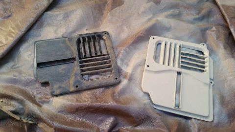 1985 Ford Bronco - Comparing a dirty vent cover to a newly painted one, likely for an interior restoration project.