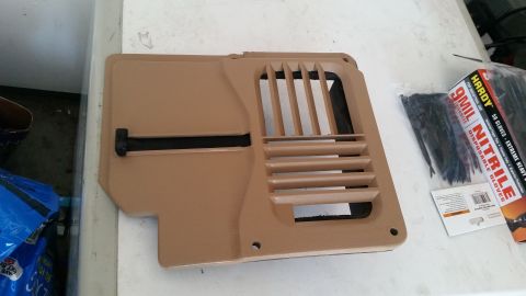 1985 Ford Bronco - A tan plastic vent cover with a black insert is shown on a white surface next to a package of black disposable nitrile gloves. The vent cov…