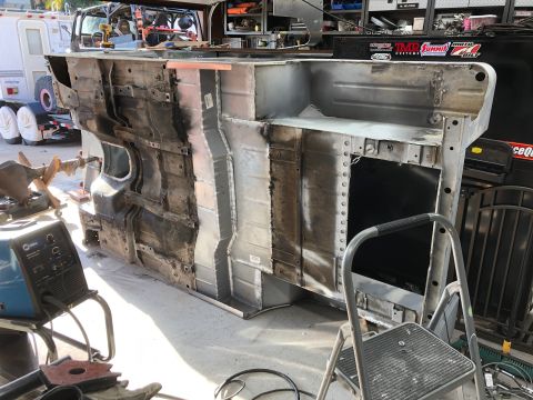 1992 Jeep Wrangler - The underside of a heavily modified Jeep Wrangler chassis is shown, undergoing restoration or repair. Various metal panels have been welded…