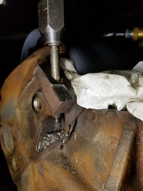 1996 Ford Bronco - I chased the remaining bolt thread & corrosion out with a tap, and cleaned the pocket at the top. See the PREVious & NEXT few pics...