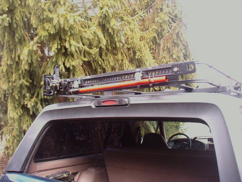 1993 Ford Bronco - Hi Lift Jack Mounted to Surco Rack, using home made mounting system similair to Hi lifts 4xRack, With Padlocks
