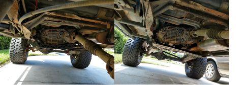 1992 Ford Bronco - Underside view of a modified vehicle's drivetrain, with a second vehicle in the background.