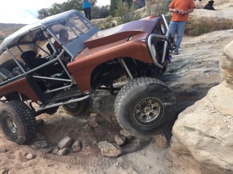 1984 Ford Bronco - Custom off-road vehicle tackling a challenging rock crawling course.