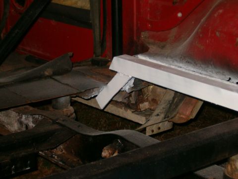 1979 Ford Bronco - This image shows the undercarriage of a vehicle, focusing on areas of rust and recent repair work.