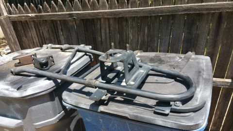 1996 Ford Bronco - This is a spare tire carrier assembly, likely removed for refinishing or repair.